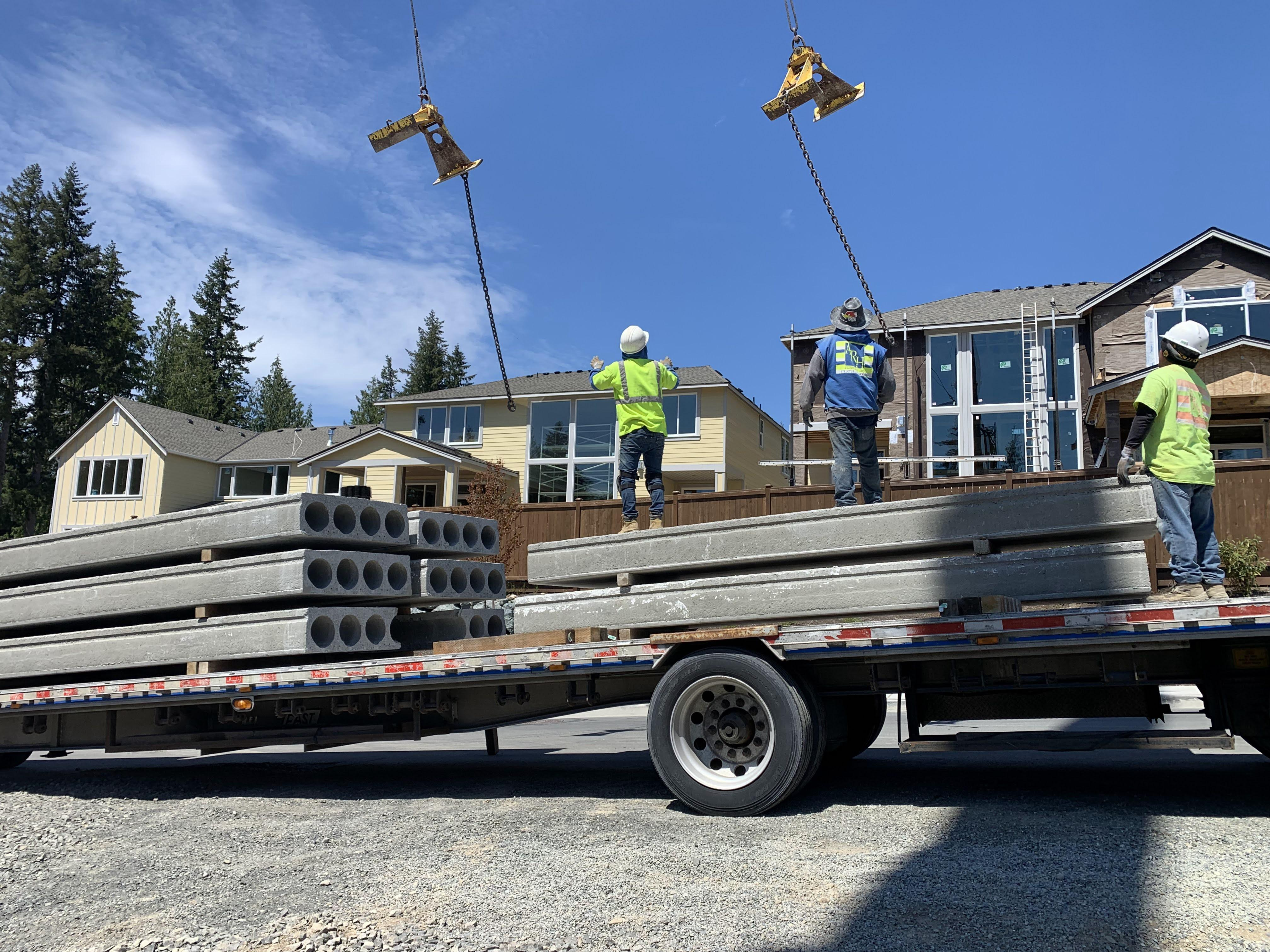 ARH & Associates workers setting up rigging panels at construction site